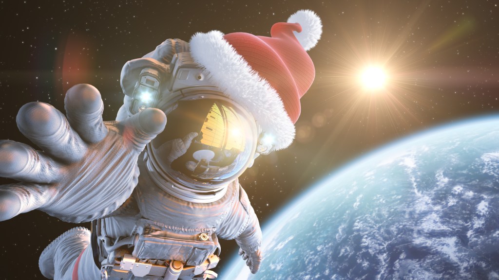 Astronaut in outer space in a Santa Claus hat virtual team building escape room event